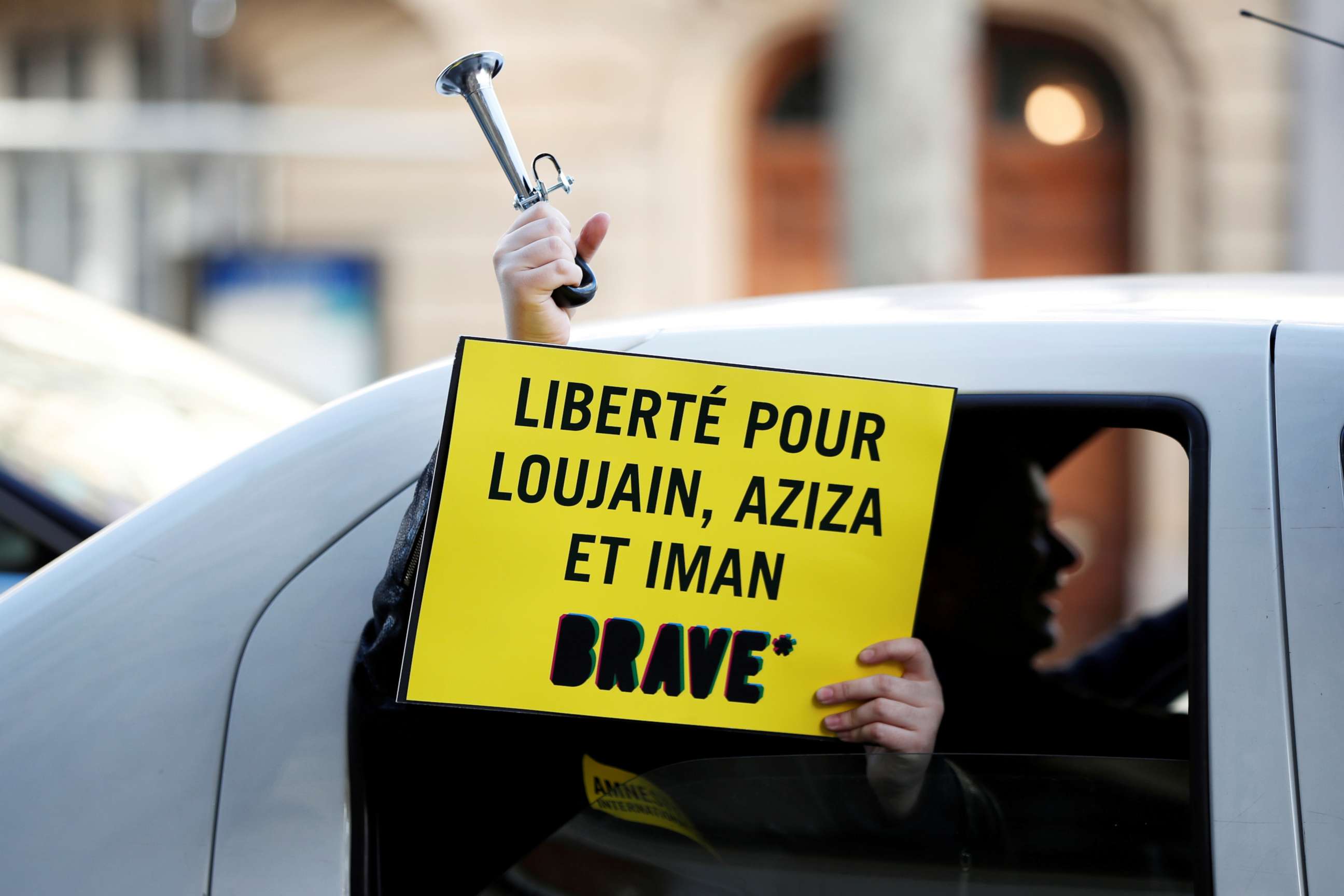 PHOTO: A demonstrator holds a placard outside the Saudi Arabian Embassy to protest on International Women's Day to urge Saudi authorities to release jailed women's activists Loujain al-Hathloul, Eman al-Nafjan and Aziza al-Yousef in Paris, March 8, 2019.