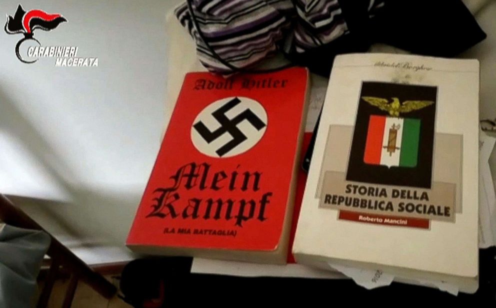 A still image from a video made available by the Italian police on Feb. 5, 2018 shows a copy of Hitler's book 'Mein Kampf,' left, and 'Storia della Repubblica Sociale' found at Luca Traini's home in Macerata, Italy, Feb. 4 2018.