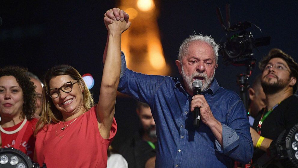PHOTO: Brazilian president-elect Luiz Inacio Lula da Silva holds the hand of his wife, Rosangela "Janja" da Silva, while delivering a speech to supporters after winning the presidential run-off election, in Sao Paulo, Brazil, on Oct. 30, 2022.