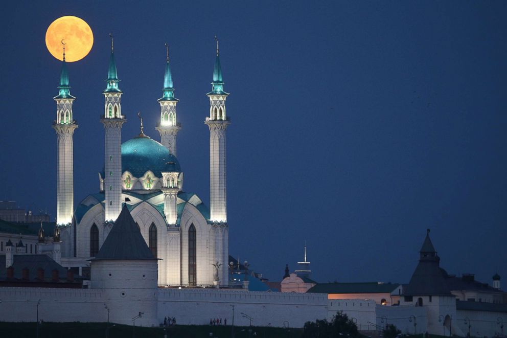 PHOTO: A blood moon is seen over the Qolsarif Mosque, Kazan, Russia.