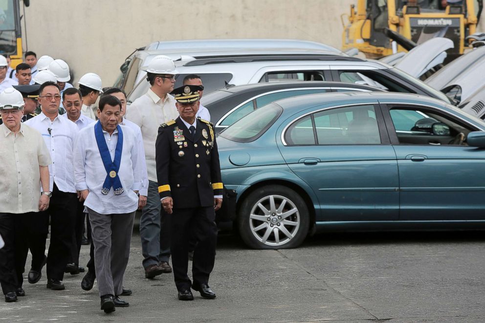 PHOTO: Philippine President Rodrigo Duterte inspects rows of seized luxury cars during the ceremonial destruction at the Bureau of Customs in Manila, Feb. 6, 2018.  