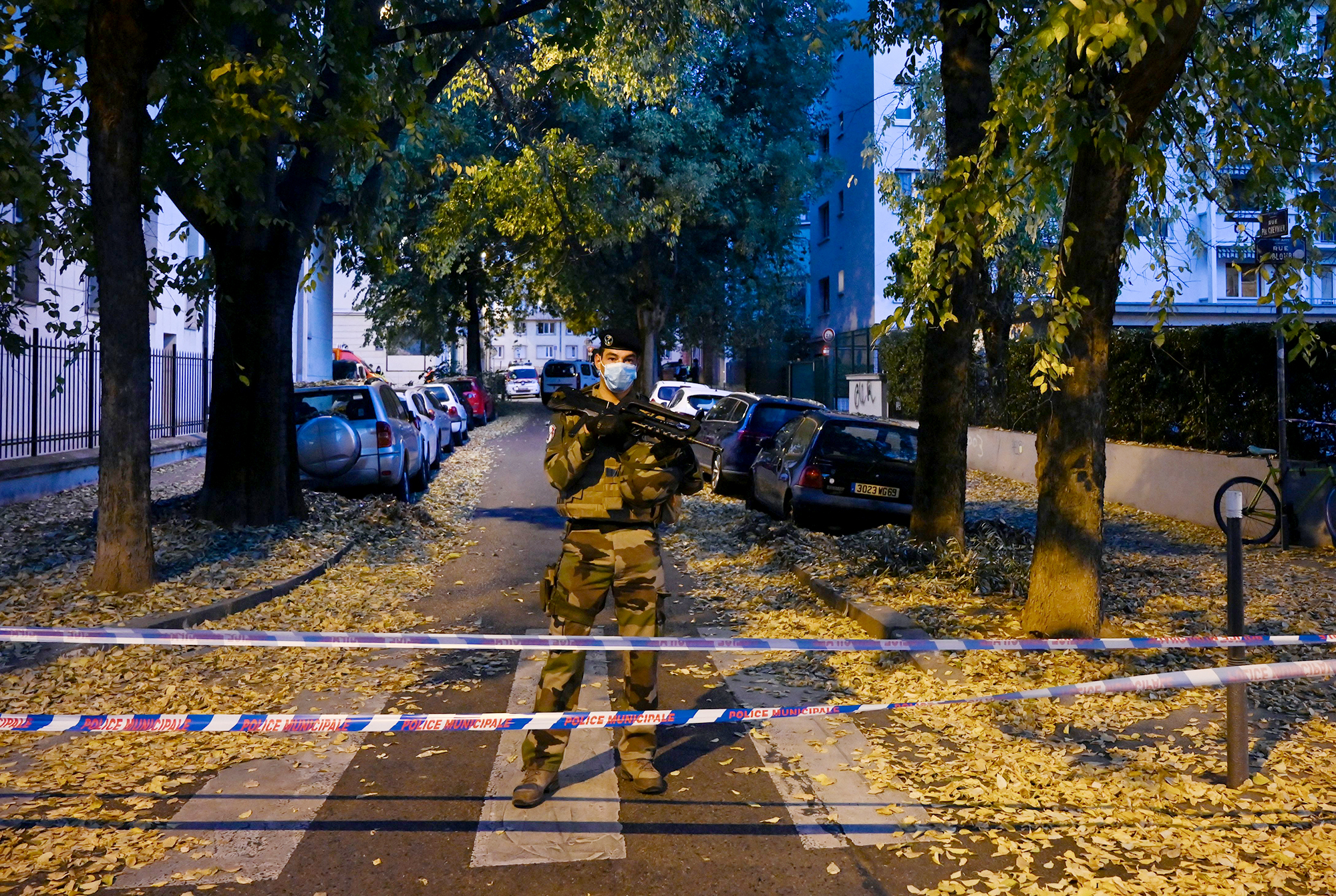 PHOTO: A French soldier stands behind a cordon near the scene where an attacker wounded an Orthodox priest before fleeing, Lyon, France, Oct. 31. 2020.