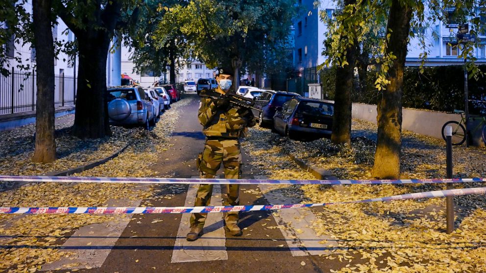 PHOTO: A French soldier stands behind a cordon near the scene where an attacker wounded an Orthodox priest before fleeing, Lyon, France, Oct. 31. 2020.