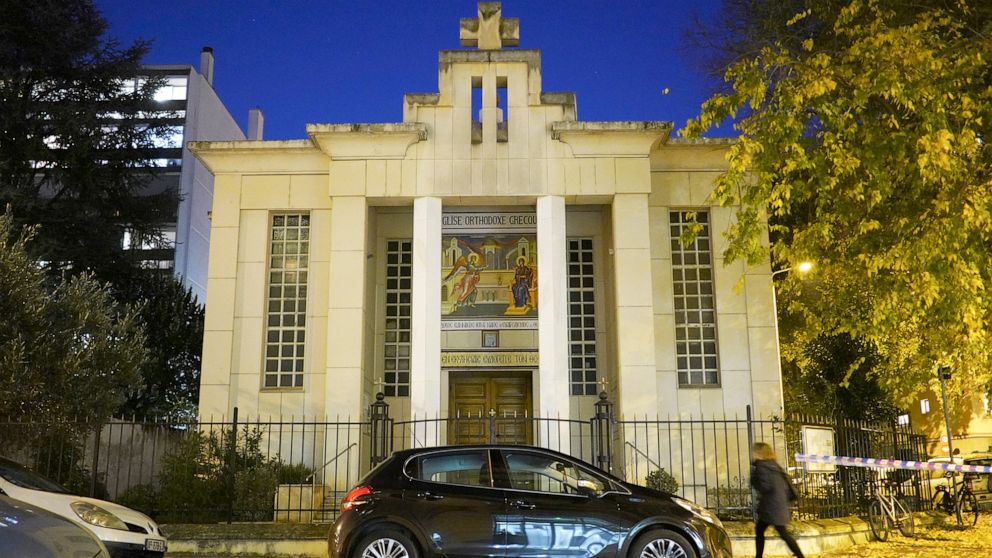 PHOTO: A woman walks past the Greek Orthodox church after a priest was shot while he was closing his church in the city of Lyon, France, Oct. 31, 2020.