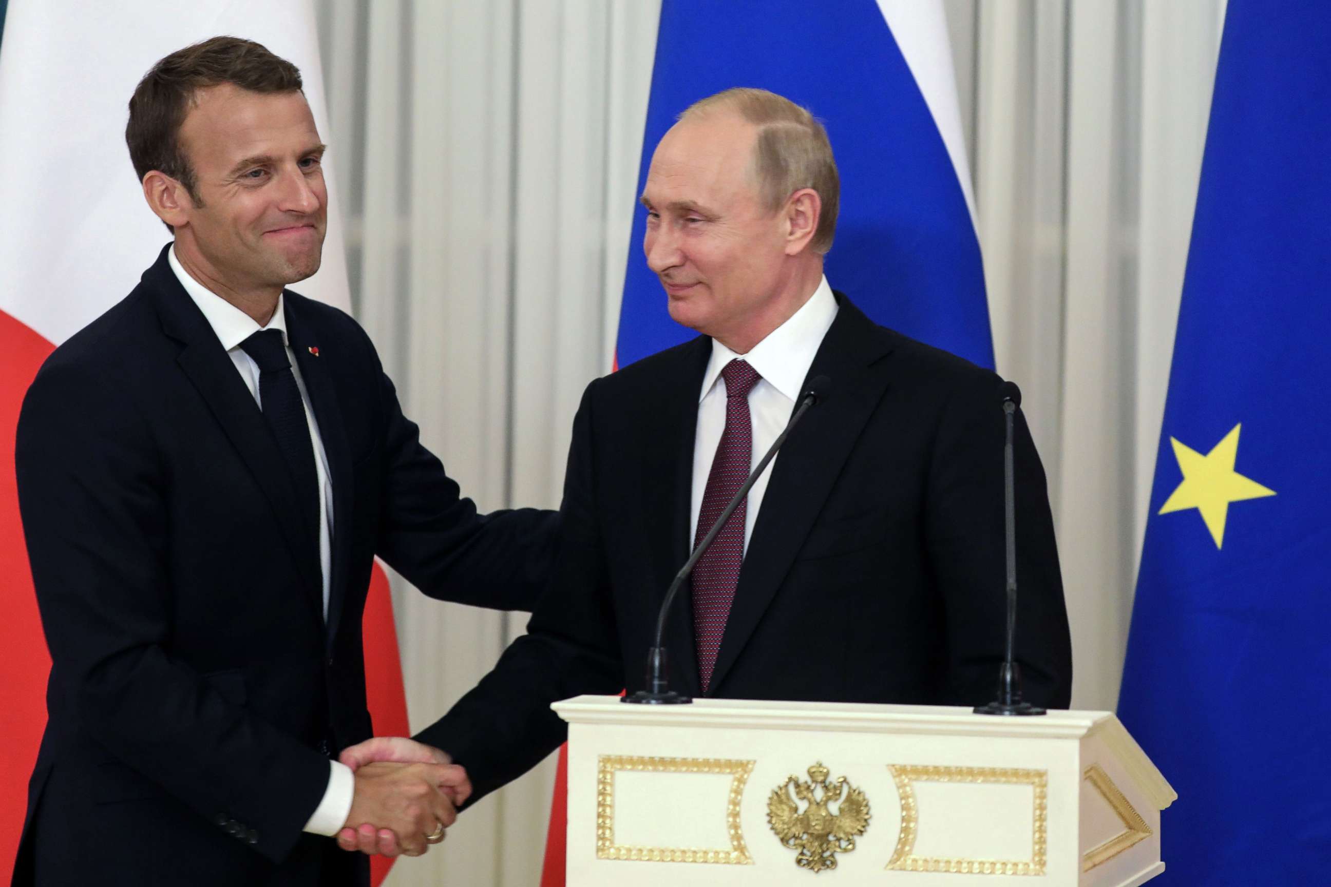 PHOTO: Russian President Vladimir Putin shakes hands with French President Emmanuel Macron at the end of a joint press conference in Saint Petersburg, Russia, May 24, 2018.