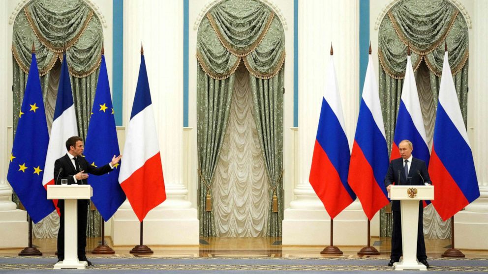 PHOTO: Russian President Vladimir Putin, right, listens during a joint press conference with French President Emmanuel Macron in Moscow on Feb. 7, 2022.