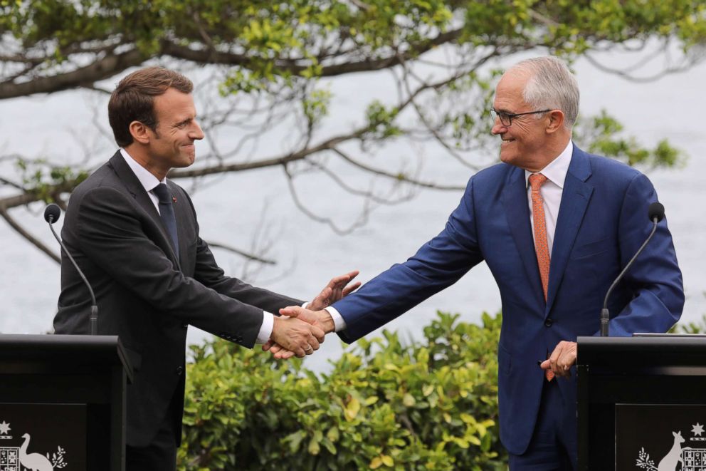 PHOTO: France's President Emmanuel Macron, left,shakes hands with Australia's Prime Minister Malcolm Turnbull during a joint press conference at Kirribilli House in Sydney on May 2, 2018.