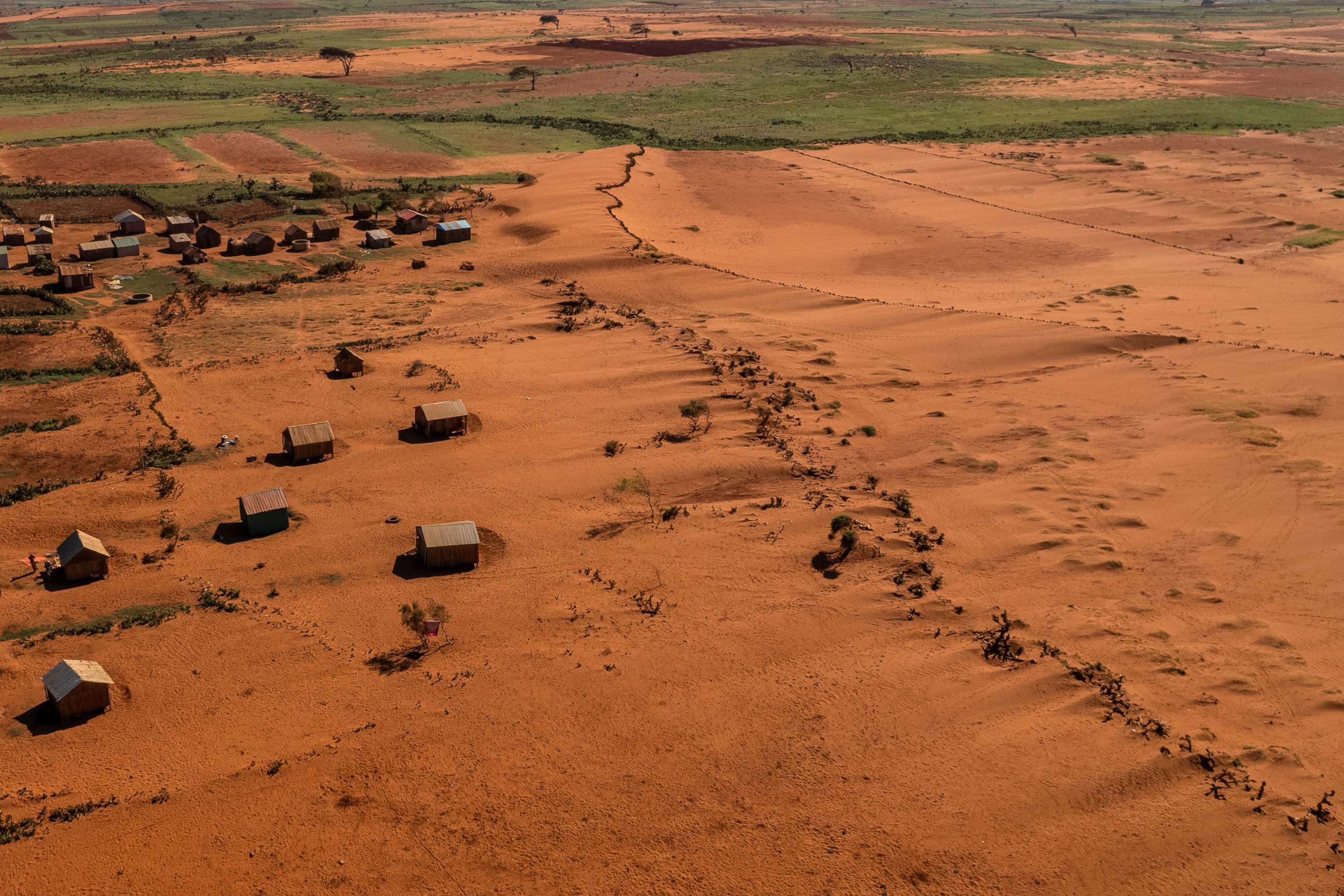 PHOTO: Sand begins to surround houses close to the town of Ambovombe, Androy region, Madagascar, Feb. 15, 2022.