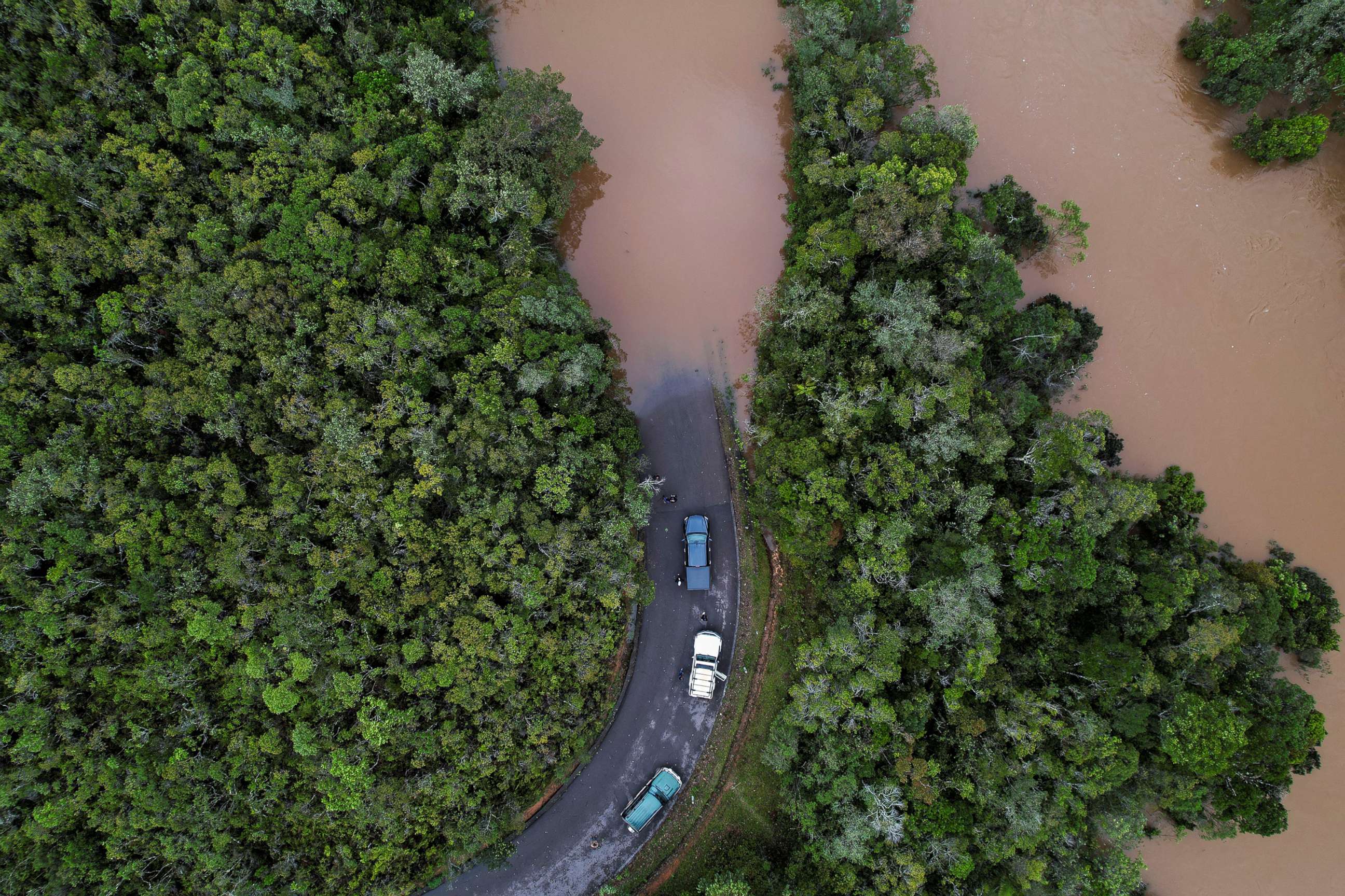PHOTO: Cars stop before a flooded area, after Cyclone Batsirai made landfall, on a road in Vohiparara, Madagascar, Feb. 6, 2022.