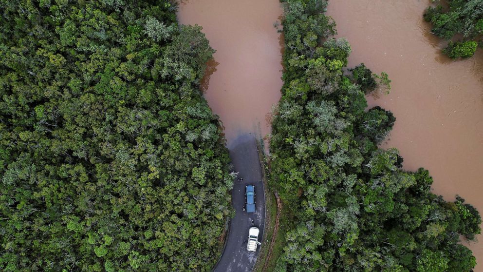 PHOTO: Cars stop before a flooded area, after Cyclone Batsirai made landfall, on a road in Vohiparara, Madagascar, Feb. 6, 2022.