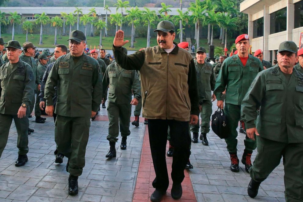 PHOTO: Venezuela's President Nicolas Maduro, center, greets military troops accompanied by Defense Minister Vladimir Padrino, left,  at the "Fuerte Tiuna" in Caracas, Venezuela, May 2, 2019, in a photo released by the Miraflores Palace press office.