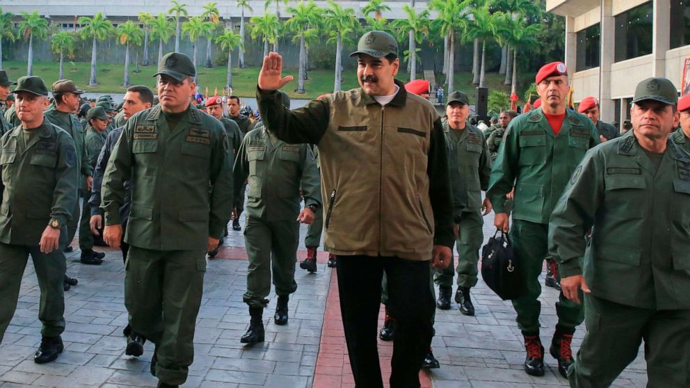 PHOTO: Venezuela's President Nicolas Maduro, center, greets military troops accompanied by Defense Minister Vladimir Padrino, left,  at the "Fuerte Tiuna" in Caracas, Venezuela, May 2, 2019, in a photo released by the Miraflores Palace press office.