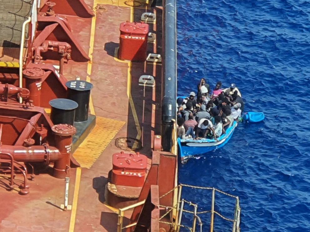 PHOTO: Migrants sit in a boat alongside the Maersk Etienne tanker off the coast of Malta, Aug. 19, 2020.