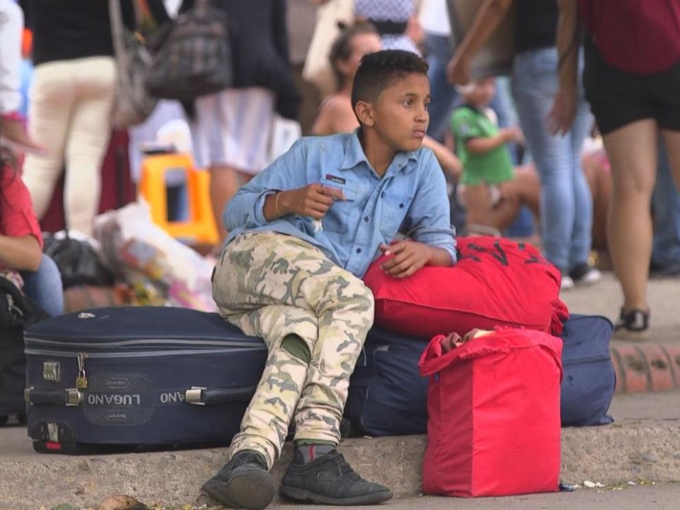 PHOTO: A Venezuelan boy guards bags at the Simon Bolivar International Bridge in Cucuta, Colombia. More than 2 million Venezuelans have fled misery in their country in the past few years.