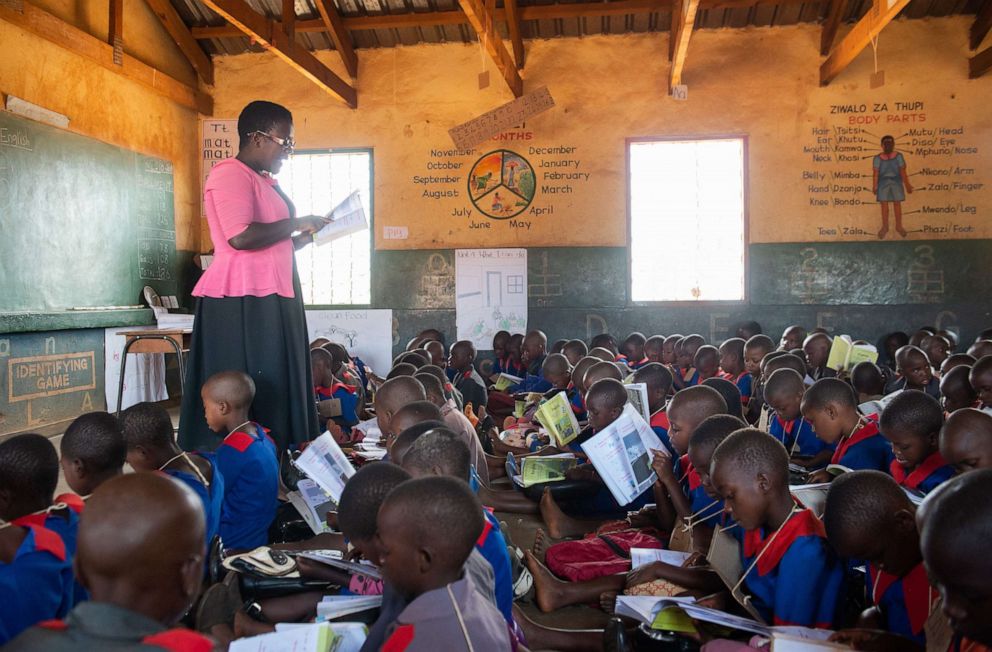 PHOTO: In this Oct. 4, 2018, file photo, a teacher instructs students as they sit in their classroom during a visit by the U.S. First lady to the Chipala Primary School in Lilongwe, Malawi.