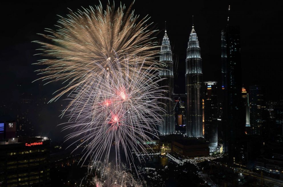 PHOTO: Fireworks illuminate the sky near Malaysia's Petronas Twin Towers during New Year celebrations in Kuala Lumpur, Jan. 1, 2018. 