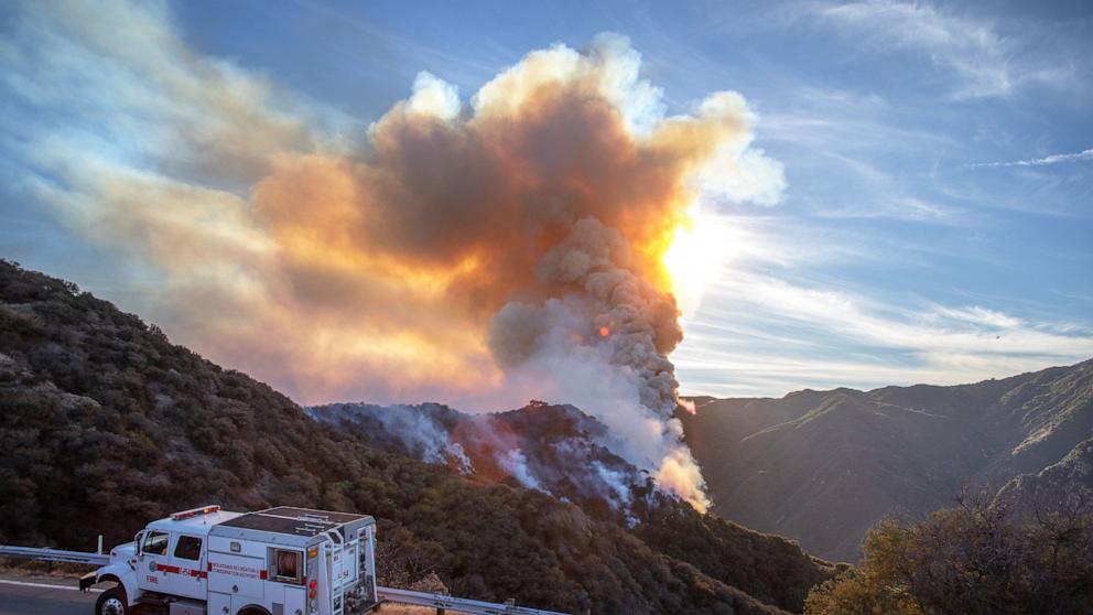 PHOTO: A fire truck drives on Piuma road as the Franklin Fire burns in the mountains on Dec. 10, 2024, near Malibu, Calif.