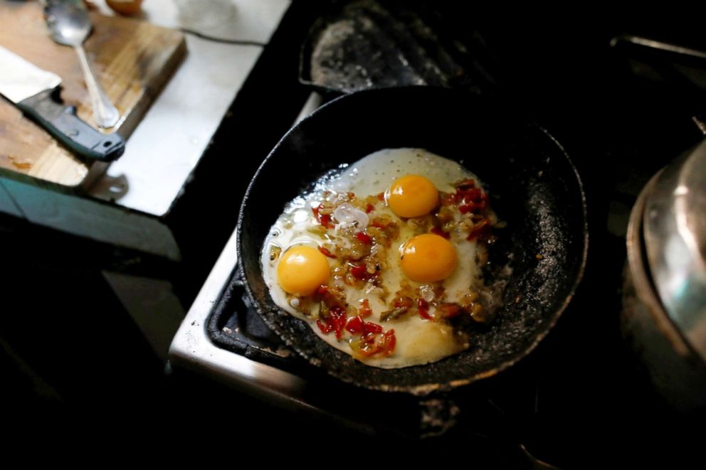 PHOTO: Eggs fry in a pan in Yaneidi Guzman's kitchen in Caracas, Venezuela, March 31, 2018.