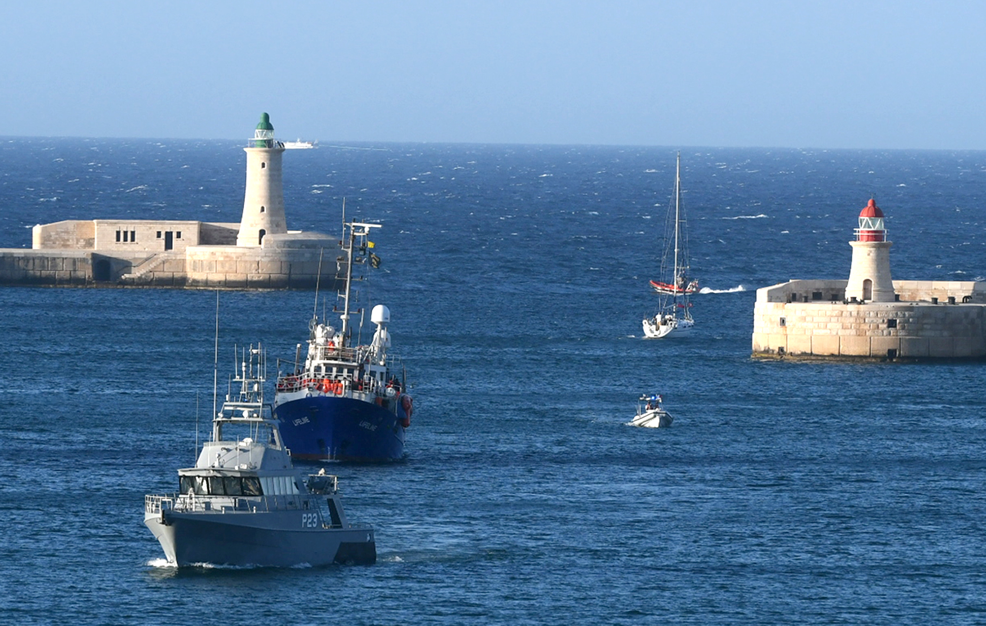 PHOTO: Escorted by a Maltese coast guard boat, the ship operated by German aid group Mission Lifeline, arrives at the Valletta port in Malta, after a journey of nearly a week while awaiting permission to make landfall, June 27, 2018.