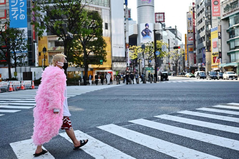 PHOTO: A man wearing a face mask crosses a street in Tokyo, Japan, on April 8, 2020.