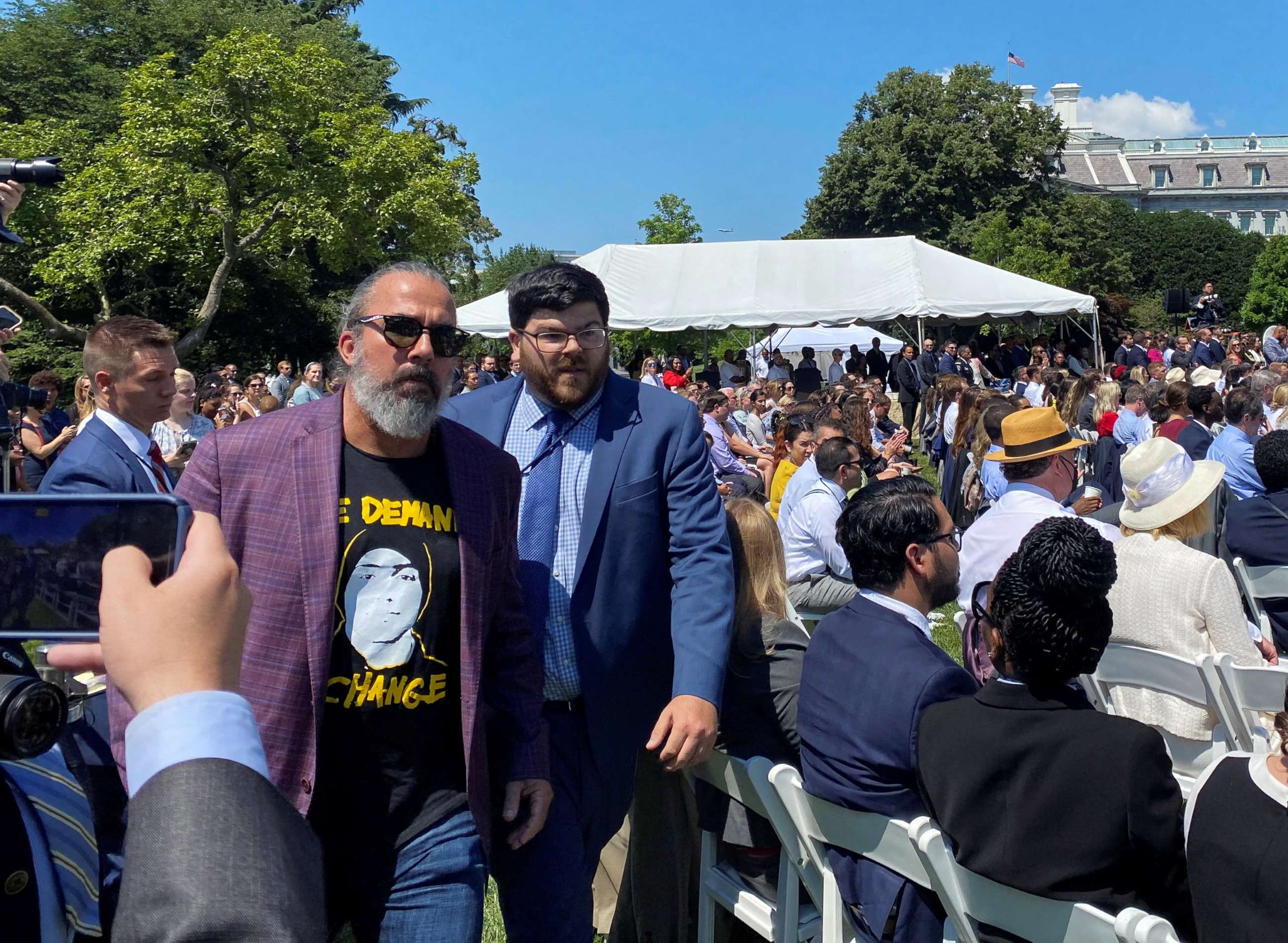 PHOTO: Manuel Oliver is escorted out after calling for additional gun control action during President Joe Biden's event for the passage of the "Safer Communities Act" at The White House in Washington, July 11, 2022.