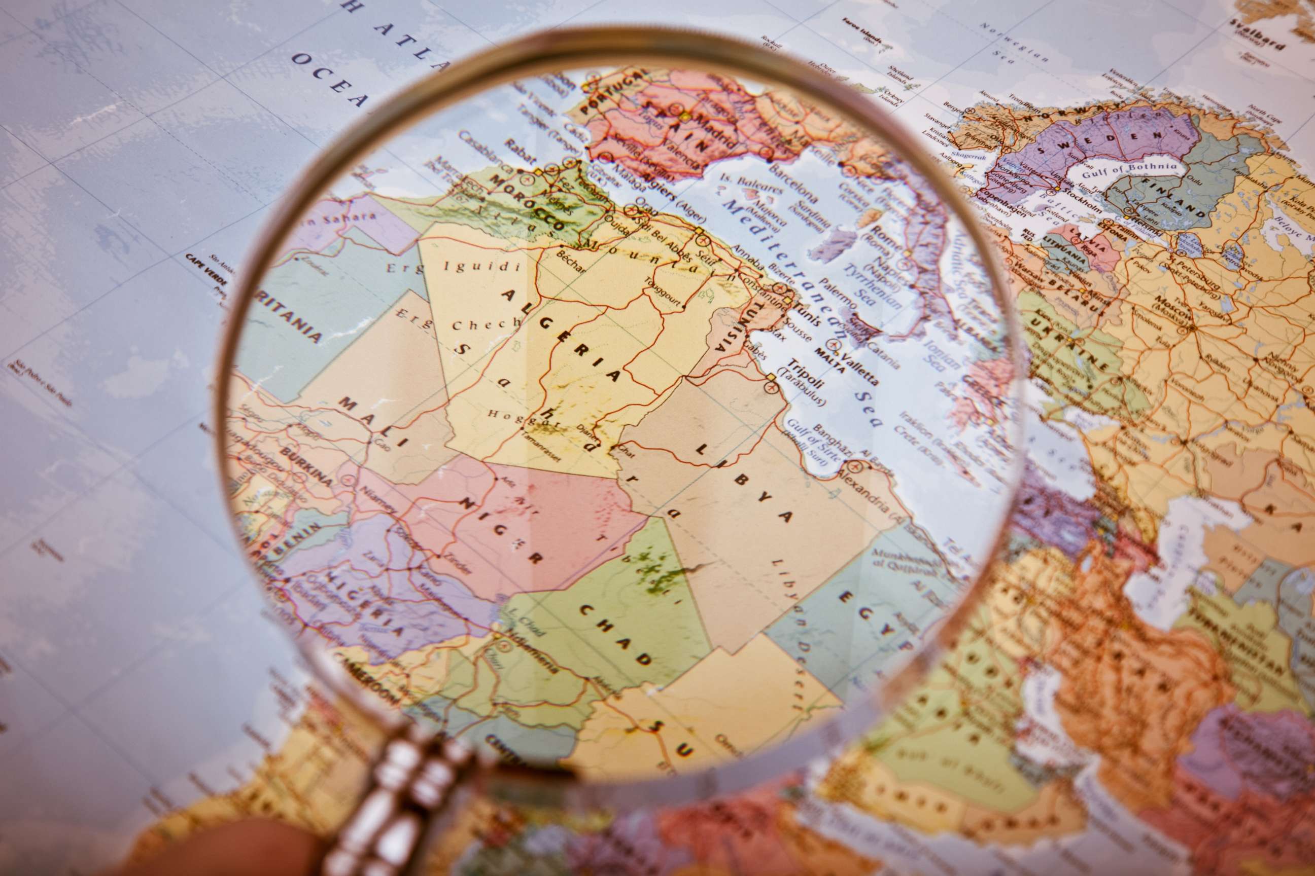 PHOTO: A magnifying glass hovers over a map of North and West Africa in this undated stock photo.