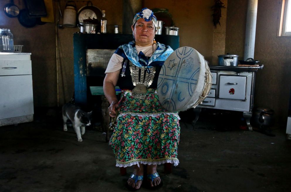 PHOTO: Kallfurayen Llanquileo, a Mapuche healer and religious leader known as a "Machi," poses for a photo with her shaman drum at her home in the Mapuche community Enoco in Temuco, Chile, Jan. 8, 2018.