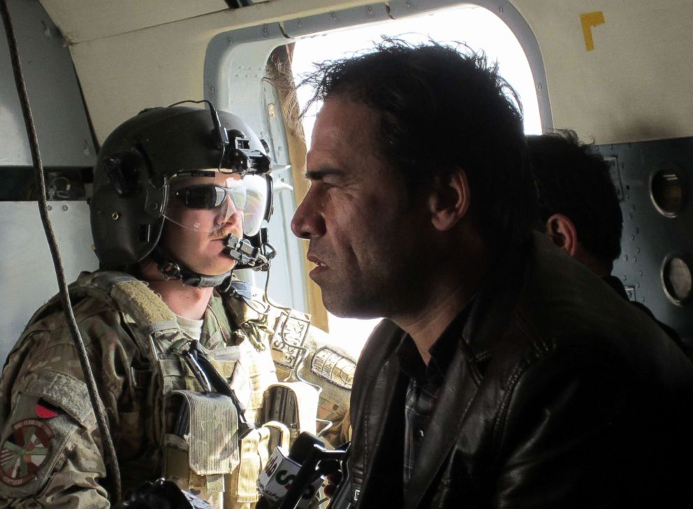 PHOTO: This photo taken in 2013 shows Agence France-Presse (AFP) photographer Shah Marai sitting in a helicopter with a member of the International Security Assistance Force (ISAF) while on assignment in Afghanistan.
