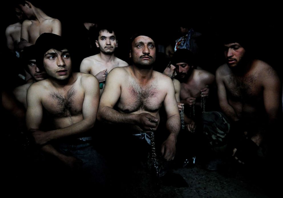 PHOTO: Afghan men hold chains as they wait to take part in ritual self-flagellation to celebrate the Muslim festival of Ashura, at a mosque in Kabul, Jan. 15, 2008.