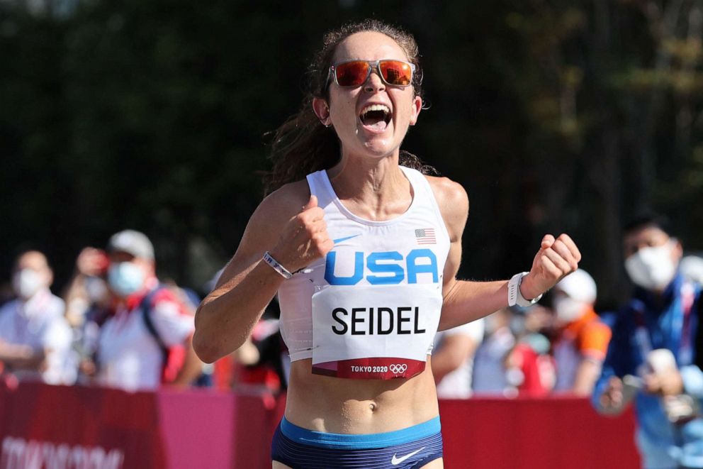 PHOTO: USA's Molly Seidel crosses the finish line of the women's marathon final during the Tokyo 2020 Olympic Games in Sapporo on Aug. 7, 2021.