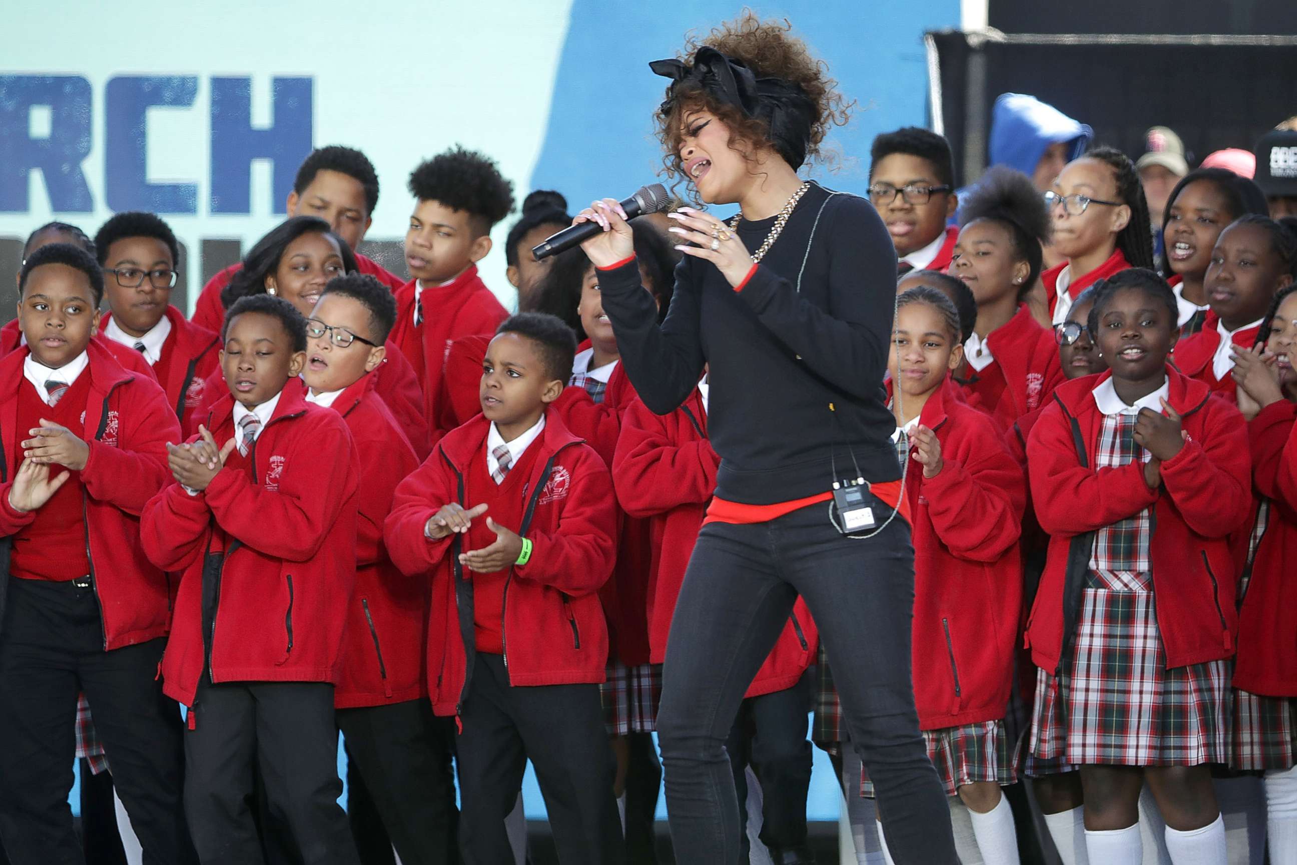 PHOTO: Andra Day performs "Rise Up" with members of the Cardinal Shehan School Choir during the March for Our Lives rally, on March 24, 2018 in Washington, D.C. 