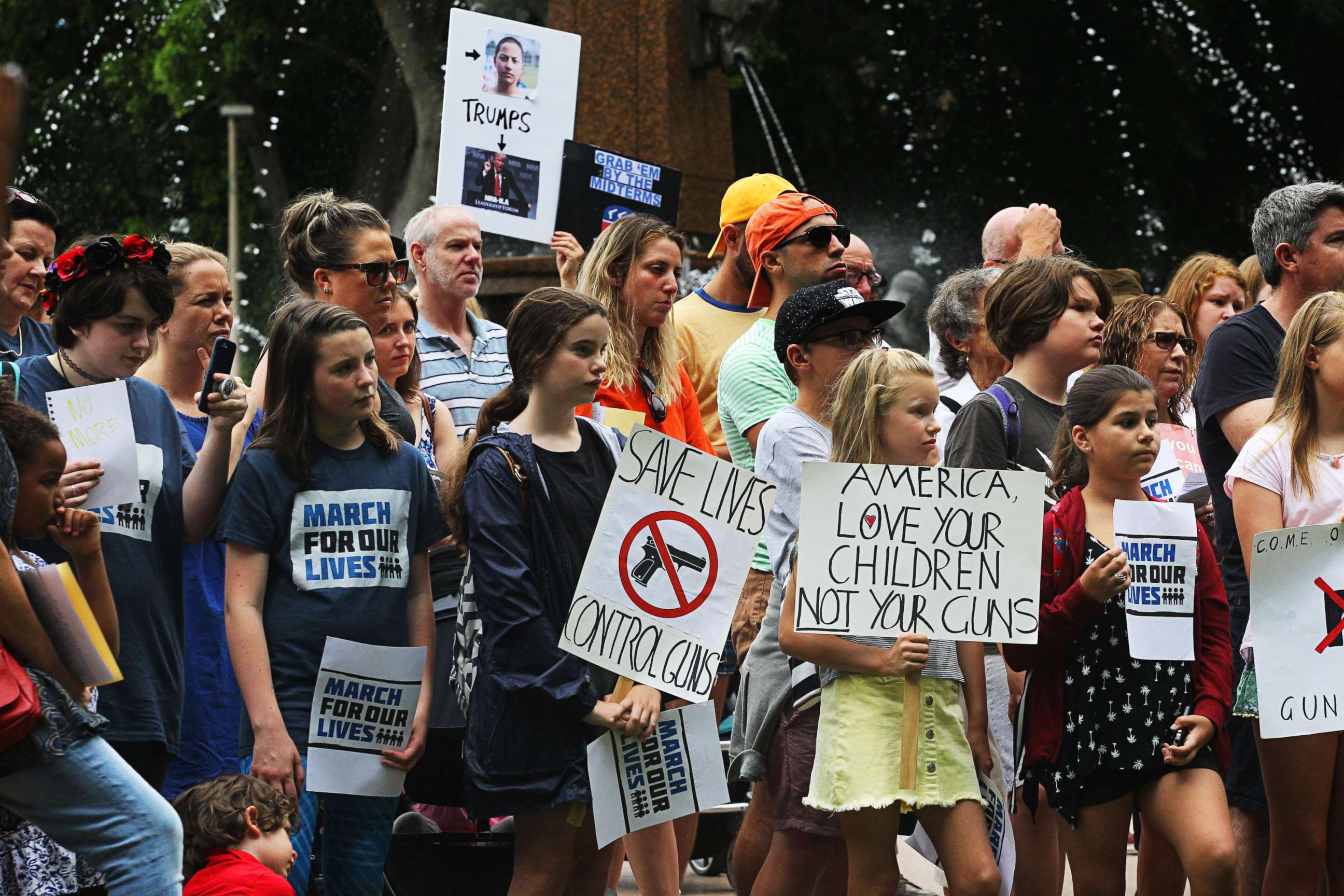 PHOTO: Demonstrators hold placards at Hyde Park in Sydney, Australia, March 24, 2018, during the March for Our Lives rally.
