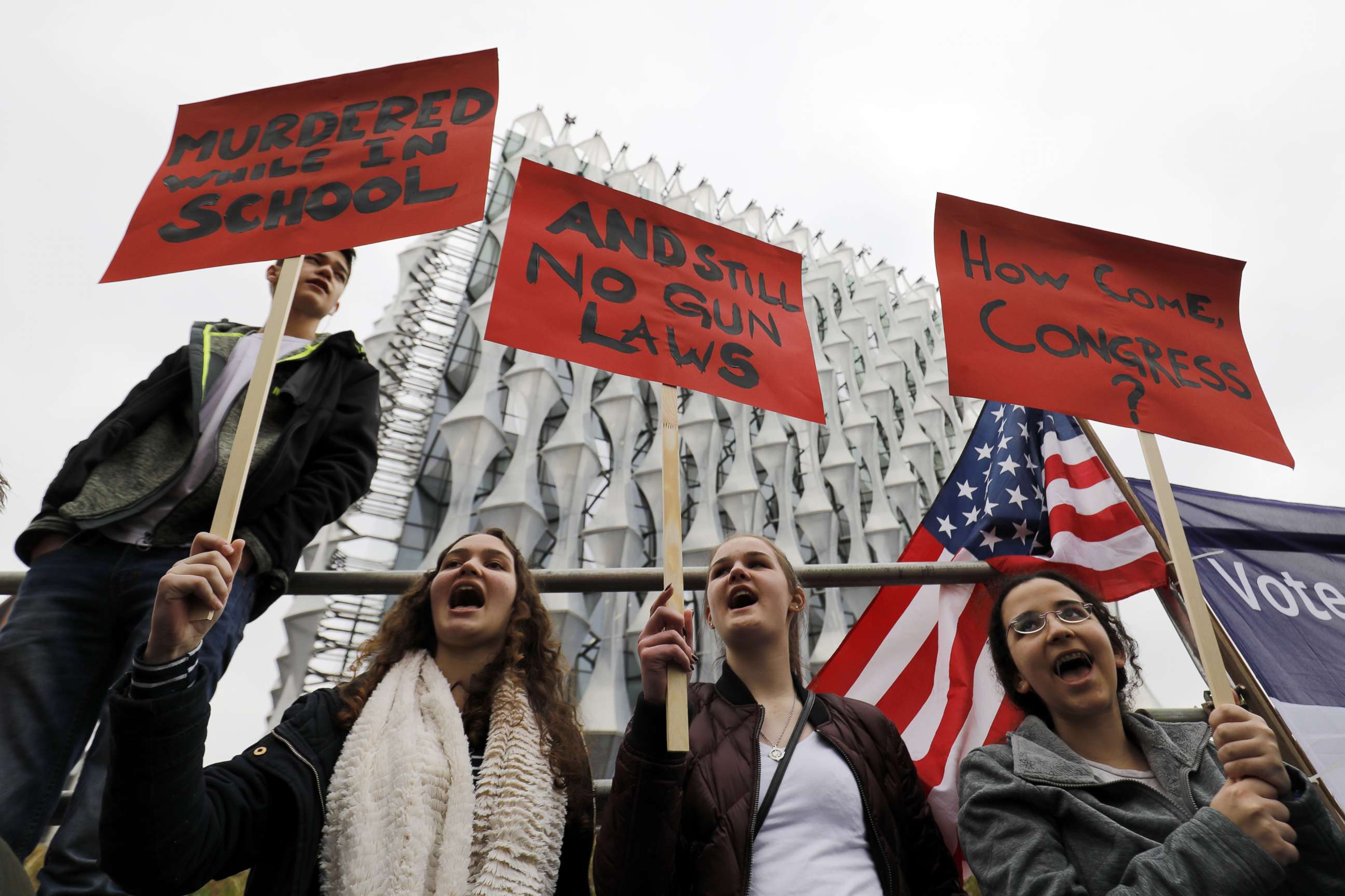 PHOTO: Protesters carry placards and shout slogans during a demonstration calling for greater gun control, outside the U.S. Embassy in south London, March 24, 2018.