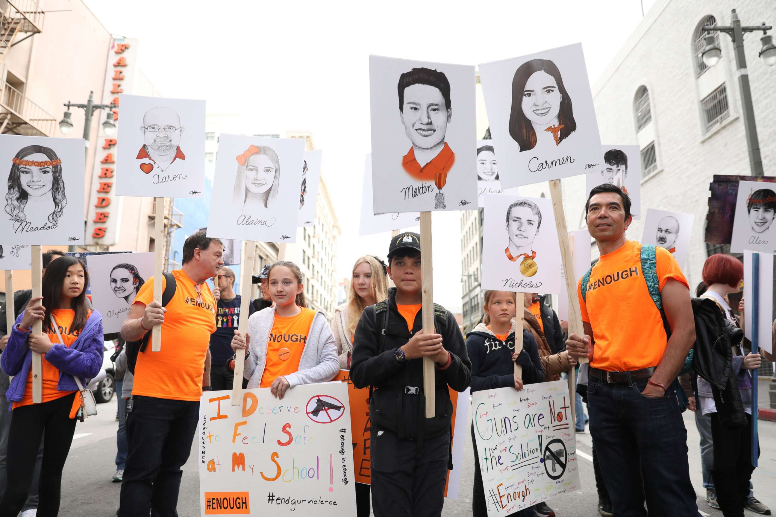 PHOTO: Students hold signs showing the students and teachers killed at Marjory Stoneman Douglas High School, during March for Our Lives in Los Angeles, March 24, 2018. 