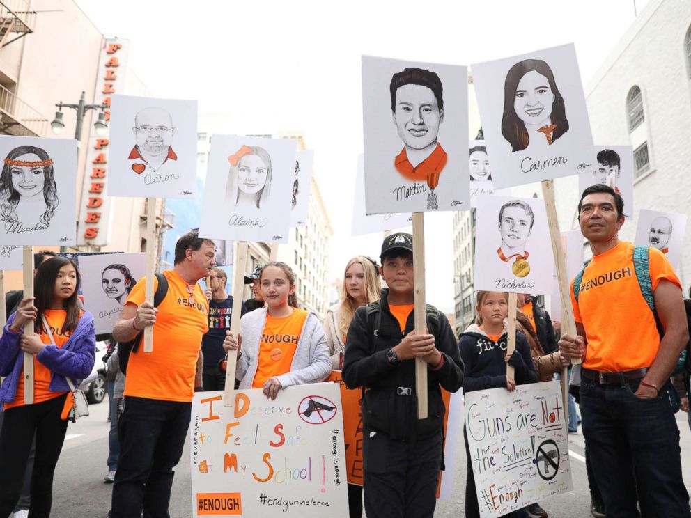 PHOTO: Students hold signs showing the students and teachers killed at Marjory Stoneman Douglas High School, during March for Our Lives in Los Angeles, March 24, 2018.