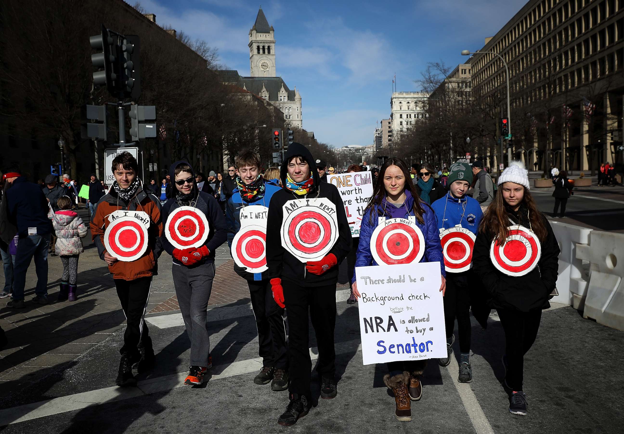 PHOTO: Students from Centreville, Virginia wear targets on their chests as they arrive for the March for Our Lives rally, March 24, 2018 in Washington, D.C. 