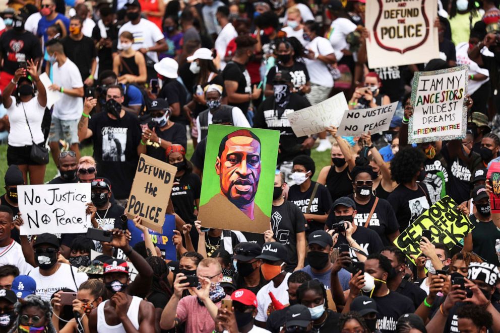 PHOTO: A portrait of George Floyd is held aloft at the Lincoln Memorial as people listen to the Rev. Al Sharpton speak during the March on Washington, Aug. 28, 2020, in Washington.