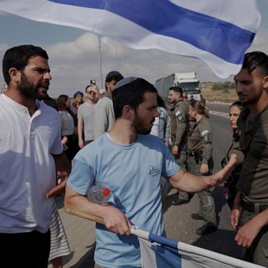 ABC News' Foreign correspondent Marcus Moore witnessed Israeli protesters attempting to block aid trucks outside of Hebron from entering Gaza.