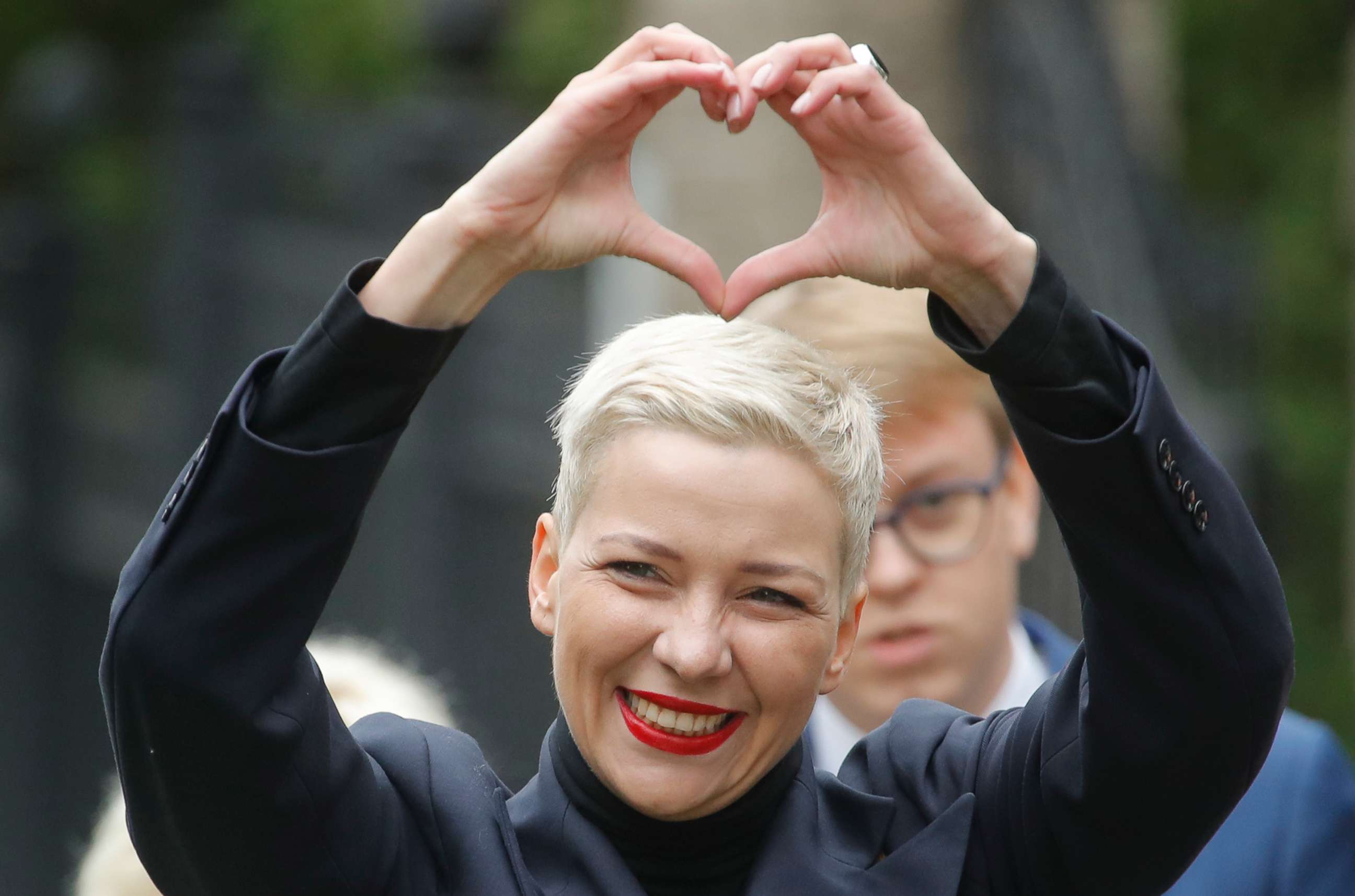 PHOTO: Belarusian opposition leader Maria Kolesnikova makes a heart sign with her hands while on her way to the Belarusian Investigative Committee in Minsk, Belarus, on Aug. 27, 2020.