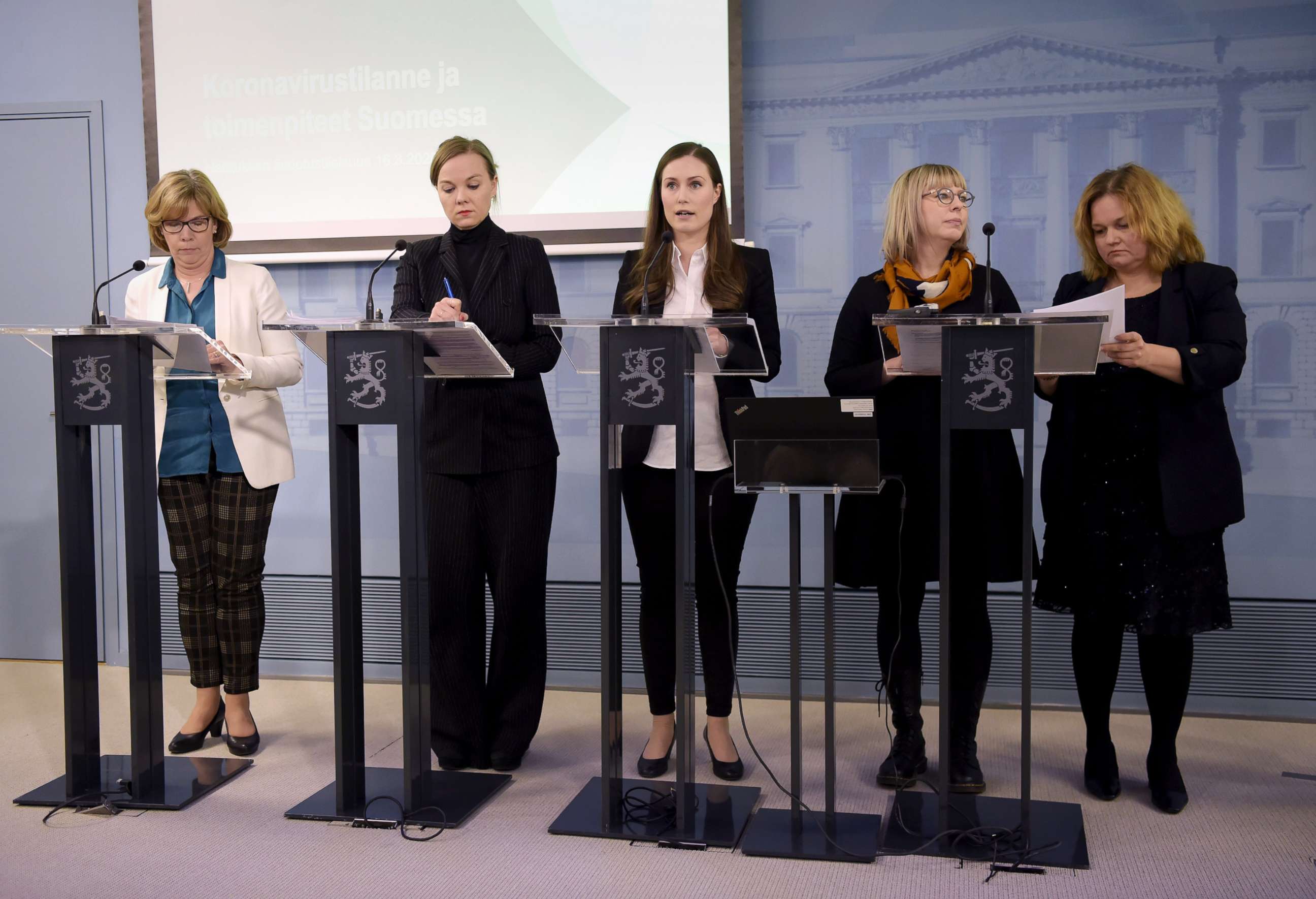 PHOTO: Prime Minister Sanna Marin, center, speaks during a a press conference to present new measures to limit the spread of the novel coronavirus in Helsinki, Finland, March 16, 2020. 