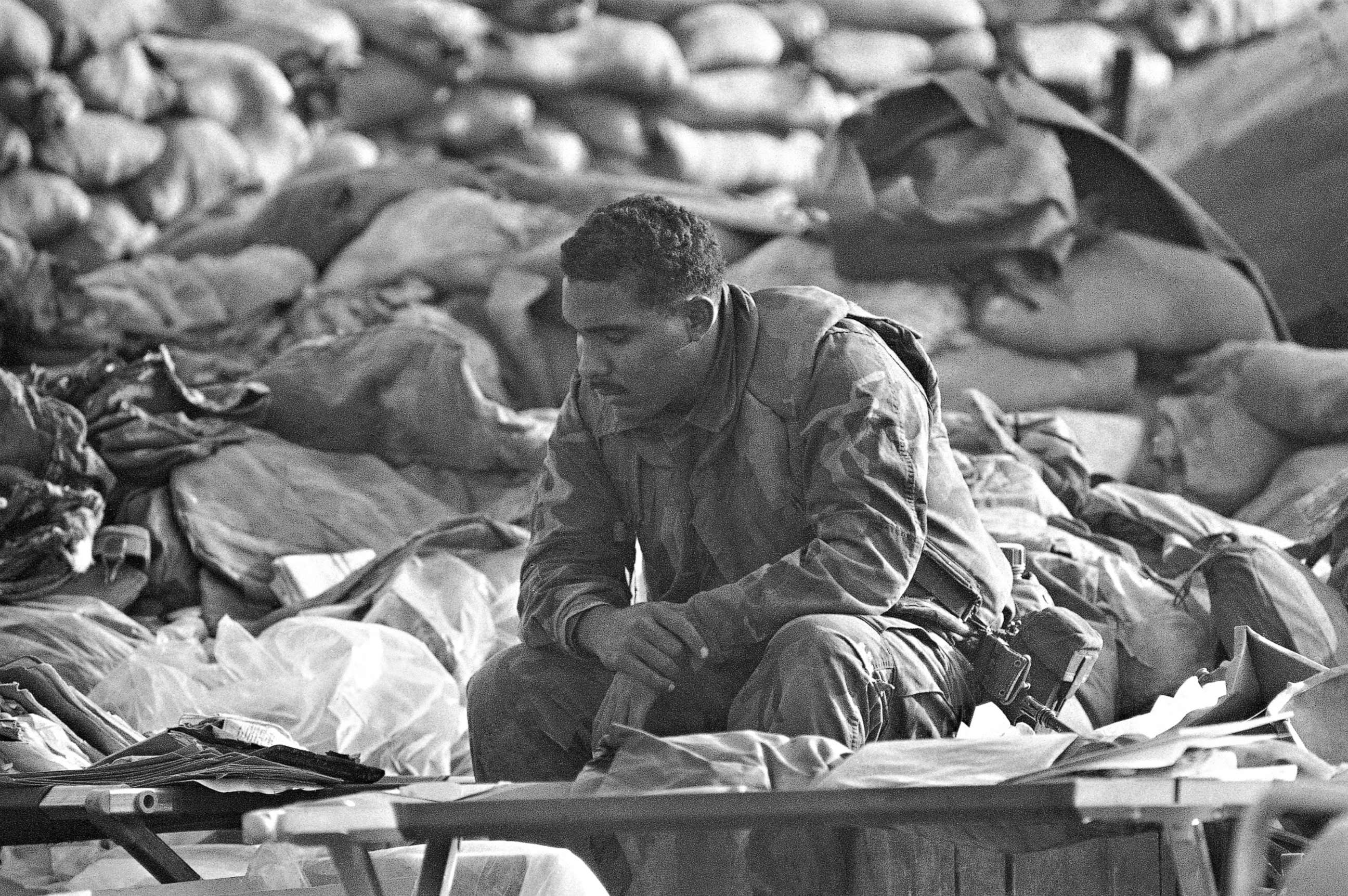 PHOTO:  U.S. Marine rests, Oct. 25, 10983, at the site of a truck bombing that leveled the Marine command center on Oct. 23. The Marine was part of the search team. 