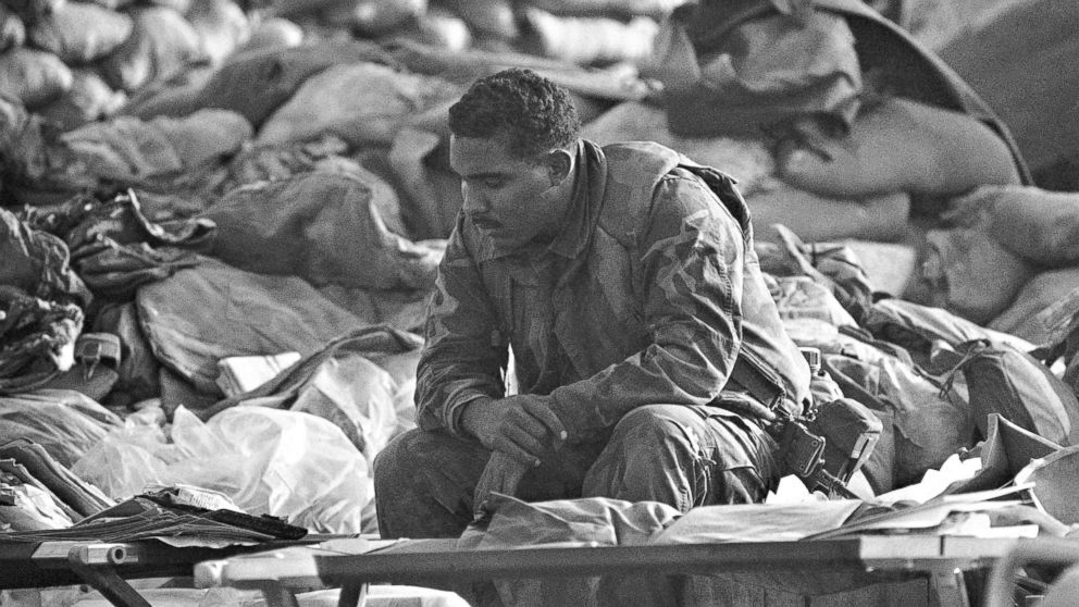 PHOTO:  U.S. Marine rests, Oct. 25, 10983, at the site of a truck bombing that leveled the Marine command center on Oct. 23. The Marine was part of the search team. 