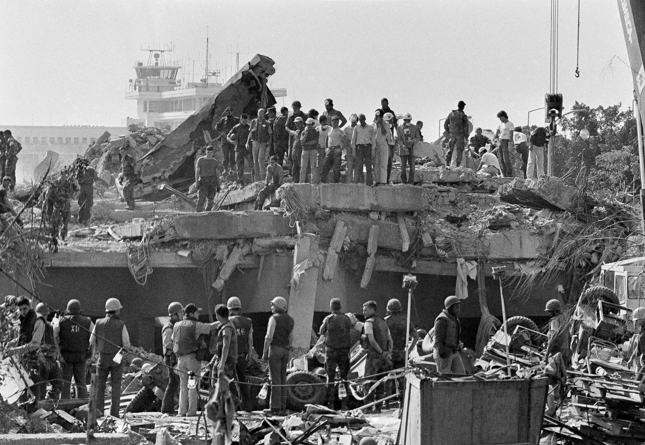 PHOTO: Rescuers probe the wreckage of the U.S. Marine barracks near the Beirut airport, a day after a suicide truck bombing, Oct. 24, 1983.