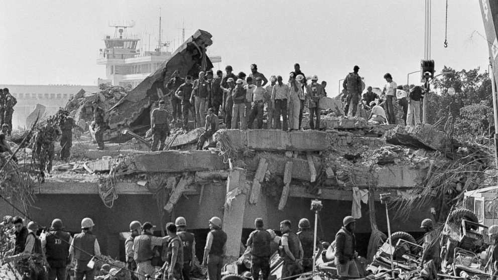PHOTO: Rescuers probe the wreckage of the U.S. Marine barracks near the Beirut airport, a day after a suicide truck bombing, Oct. 24, 1983.