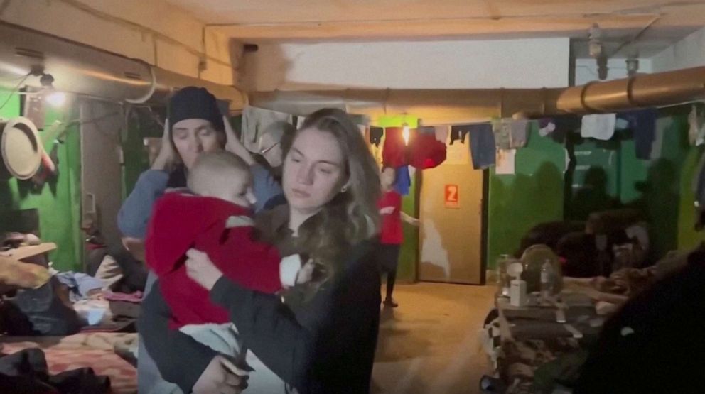 PHOTO: An image from video shows a woman holding a young child in a bunker in Mariupol, Ukraine