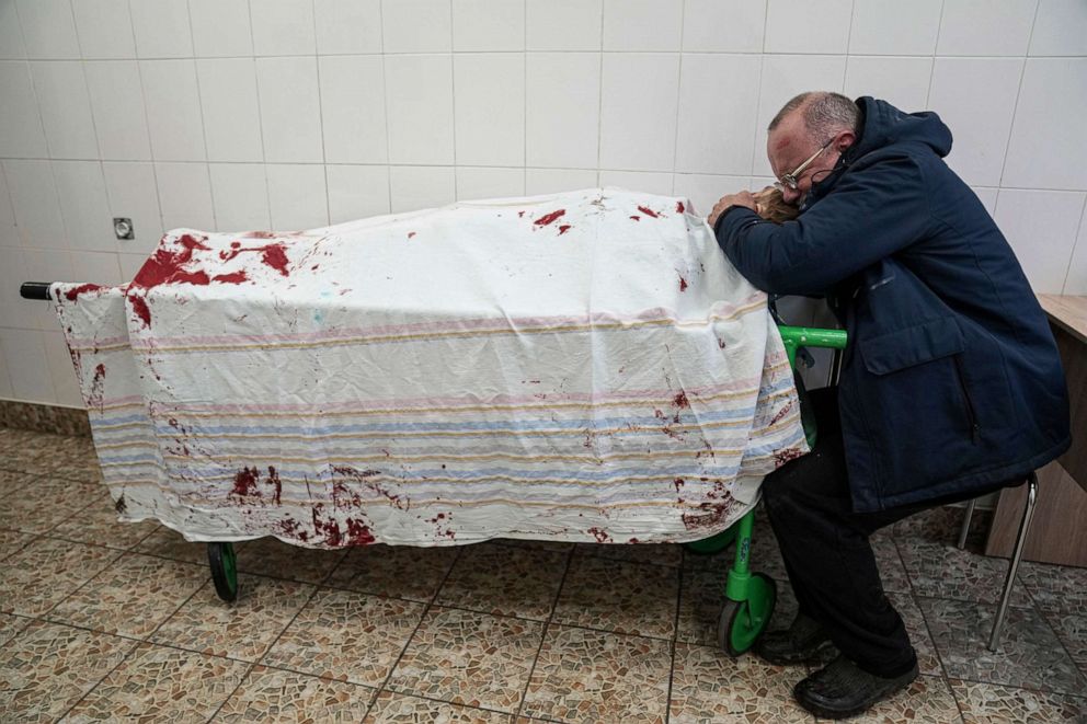 PHOTO: Serhii, father of teenager Iliya, cries over his son's lifeless body lying on a stretcher at a maternity hospital converted into a medical ward in Mariupol, Ukraine, March 2, 2022.