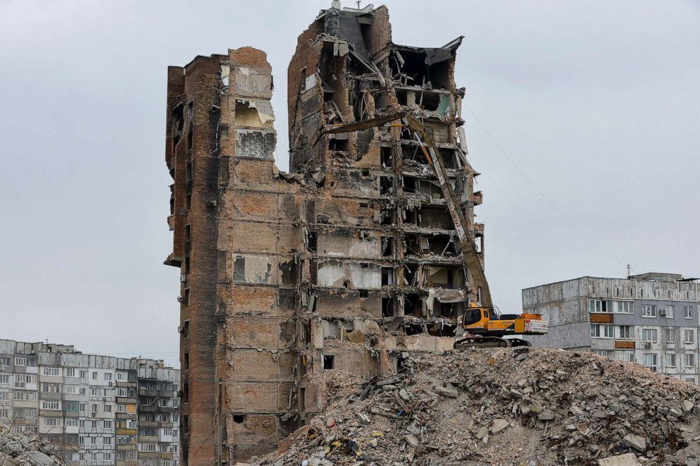 PHOTO: An excavator demolishes a multi-storey apartment block, which was destroyed in the course of Russia-Ukraine conflict, in Mariupol, Russian-controlled Ukraine, March 16, 2023.