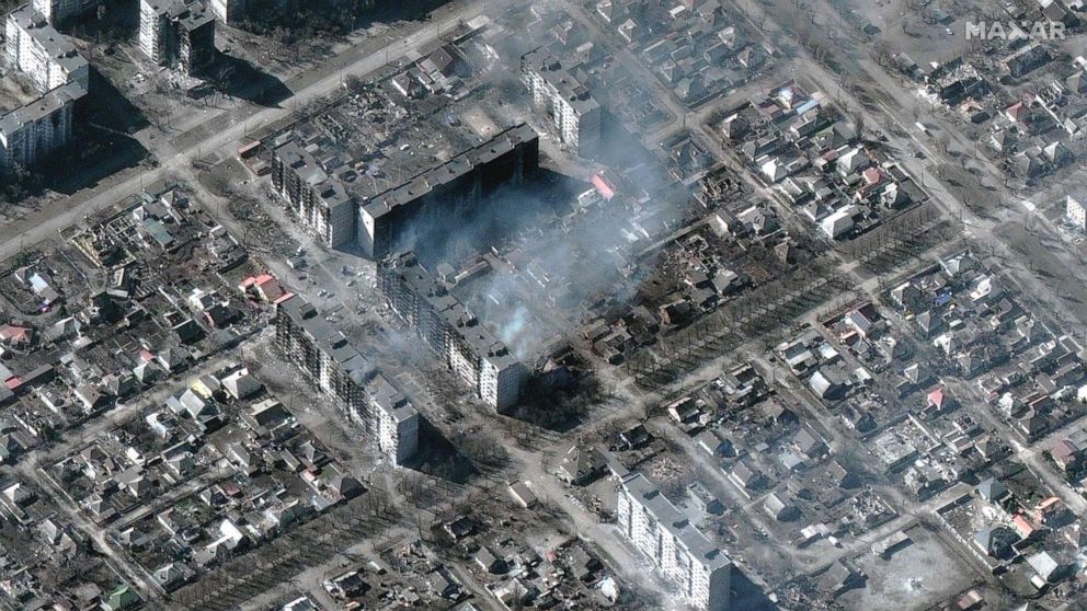 PHOTO: This Maxar satellite image taken and released on March 22, 2022, shows burning and destroyed high-rise apartment buildings in Mariupol, Ukraine.