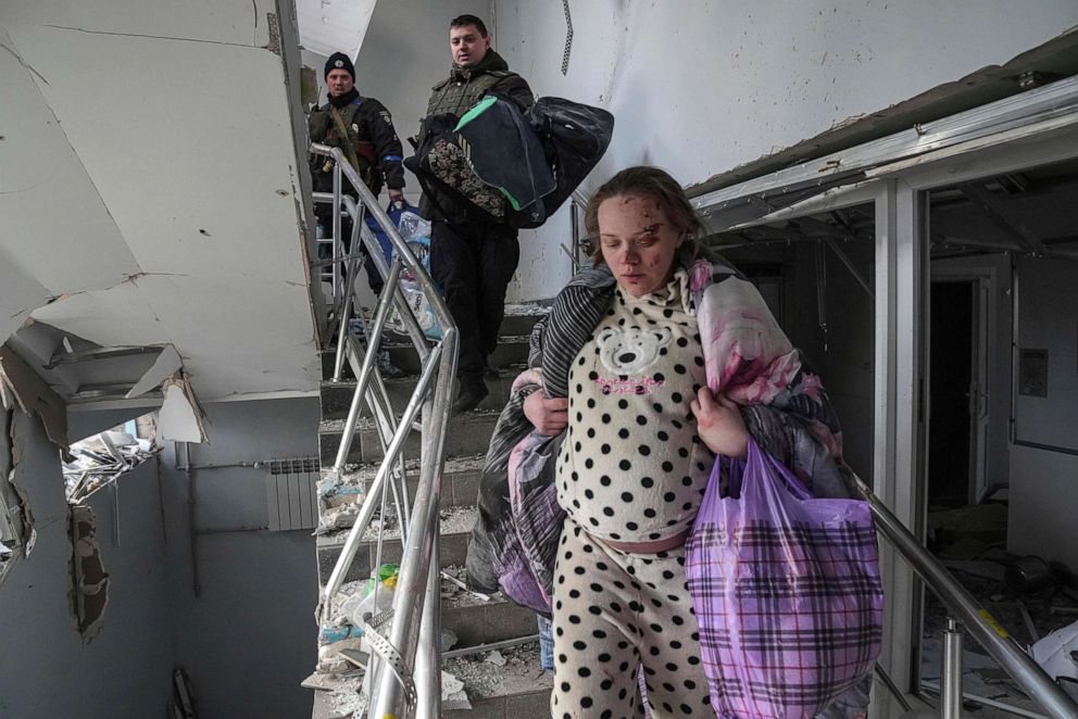 PHOTO: Mariana Vishegirskaya evacuates the damaged maternity hospital in Mariupol, Ukraine, March 9, 2022, after a Russian attack severely damaged the facility.