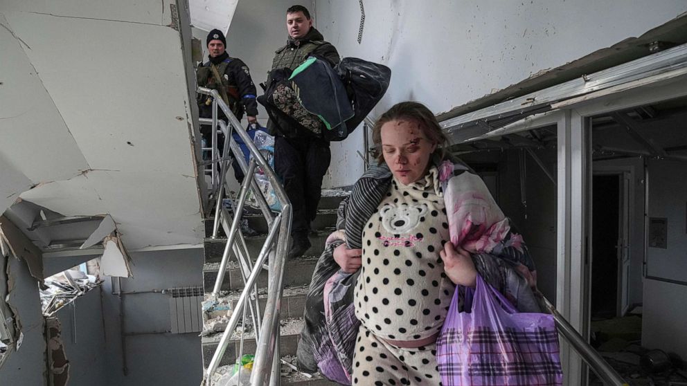 PHOTO: Mariana Vishegirskaya evacuates the damaged maternity hospital in Mariupol, Ukraine, March 9, 2022, after a Russian attack severely damaged the facility.